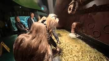 Christianne and Livia with "doctor fish" at the St. Louis Aquarium. Image by Dan Sattel