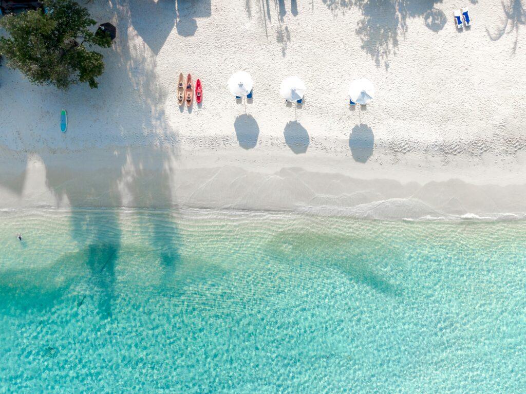 More travelers are thinking about how they travel, not just where.  Beach image by Asad Photo Maldives.