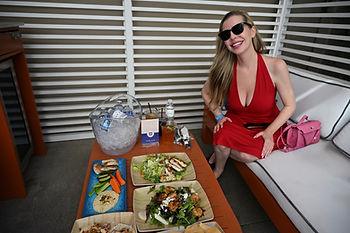 Christianne enjoying the great food from Valencia's in their cabana at Oasis Pool at The Viv Hotel.  Image by Dan Sattel