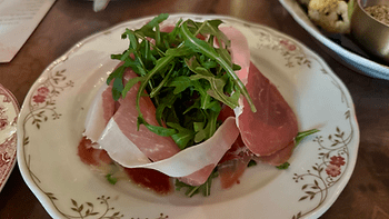 Prosciutto, Burrata, Arugula, and marinated roasted red peppers. Perfection. Image by Christianne Klein.