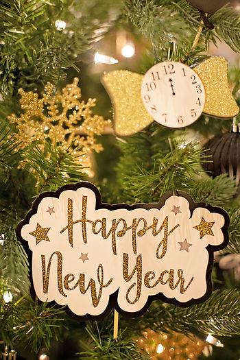Happy New Year sign on tree
