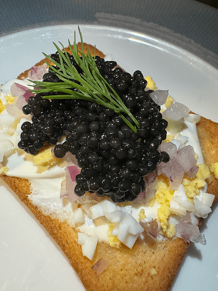 Osetra caviar on toast with creme fraiche, egg, red onion, capers, and dill. A perfect appetizer. Image by Christianne Klein.