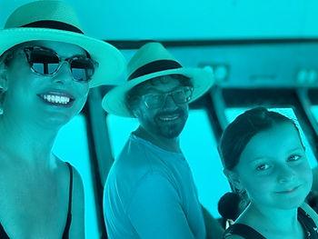 Christianne, Dan, and Livi in a submersible at The Great Barrier Reef.  Image by author.