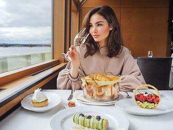 Woman on cruise drinking wine