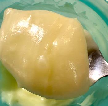 monoi body butter on spoon