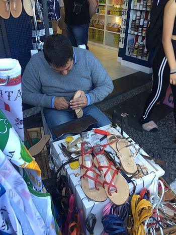 Man making sandals. 