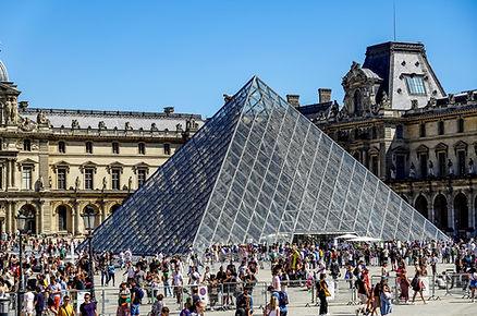 Crowded spaces, like outside the Louvre in Paris, are perfect for pickpockets.  Image by Magda Ehlers.