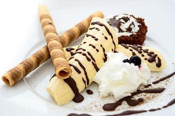 Frozen Bananas drizzled in chocolate elevates any dessert.  Photo by Pixabay.