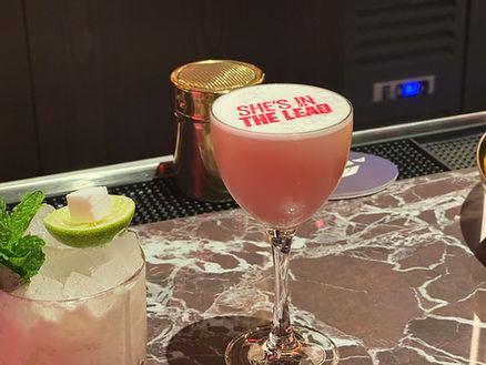 She's In the Lead- a delicious combination of Cucumber & Rose Gin, Lemon, Blueberry Wine, Rose, Egg White. Image by Christianne Klein