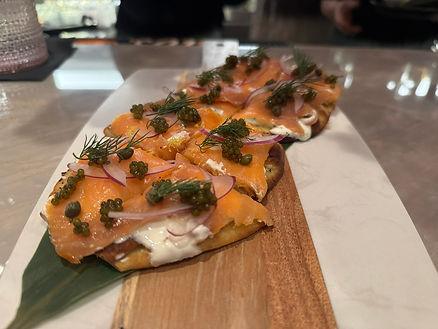 Smoked Salmon Flatbread with lemon zest and Osestra caviar.  Image by Christianne Klein. 
