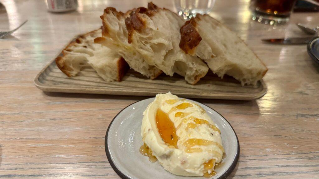 Vicia Focaccia with crispy chicken-skin butter, thyme, and honey. Image by Christianne Klein