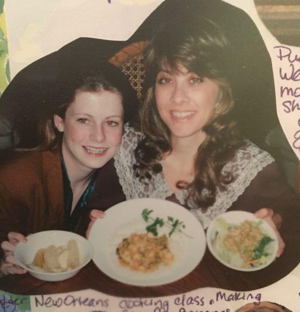 My mother and I cooking all our New Orleans taught dishes at home with me, proudly holding my favorite, our Bananas Foster. Image c/o Helene Van Sant-Klein